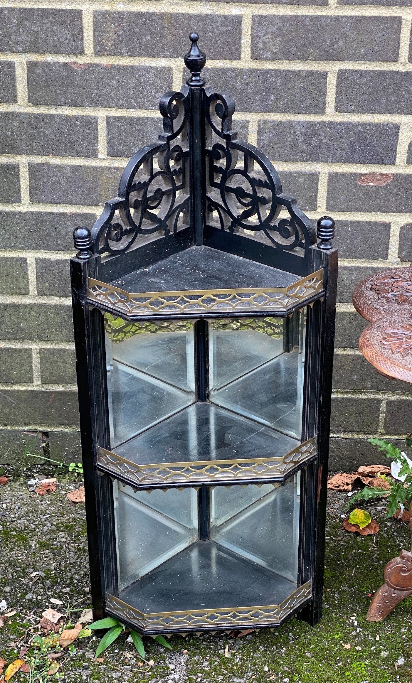Two Indian carved hardwood occasional tables, a Victorian ebonised corner wall bracket and an industrial stool